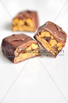 Chocolate covered bar with caramel and hazelnut