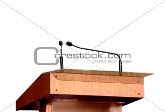 Seminar podium and microphones over white