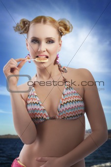 blond girl eating candy