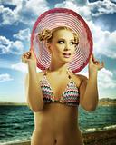 blond girl wearing pink summer hat