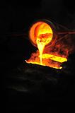Foundry - molten metal poured from ladle into mould - emptying leftover