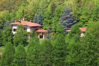House among trees. Piedmont, Northern Italy.