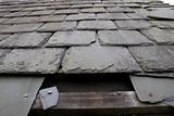 damaged roof with missing slates