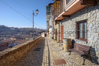 Narrow street and old house. La Morra, Northern Italy.