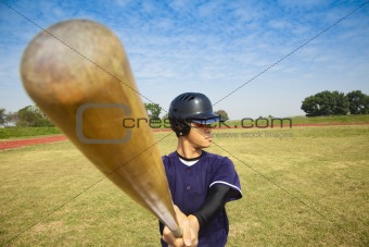 baseball player holding baseball bat