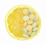 Close up of lemon and pills isolated