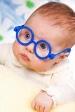 portrait of funny baby with glasses