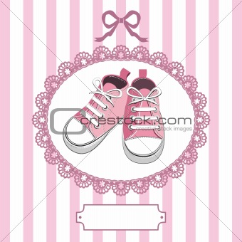 Pink baby shoes and lace frame