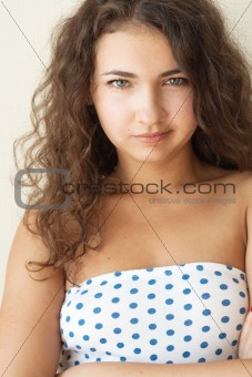 Portrait of a cute brunette with beautiful curls