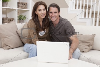 Man & Woman Couple Using Laptop Computer At Home
