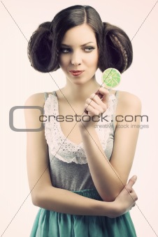 vintage girl with lollipop, she looks the lollipop