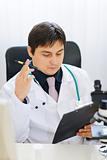 Medical doctor working at office