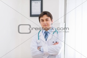 Portrait of medical doctor in cabinet