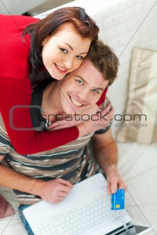 Young couple shopping on internet