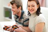Young couple plying on console