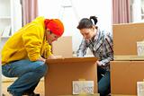 Young couple unpacking in new house