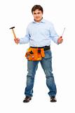 Full length portrait of construction worker with hammer and screwdriver