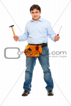 Full length portrait of construction worker with hammer and screwdriver