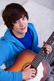 Happy teenager with guitar