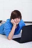 Young teenager boy with laptop