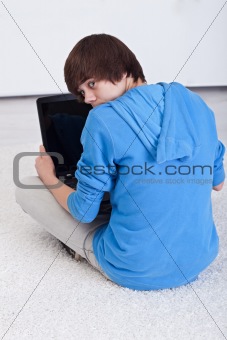 Teenager boy caught surfing the web