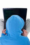 Young hacker with laptop - top view