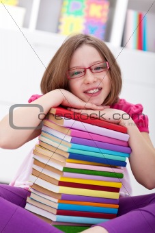 School girl with lots of books