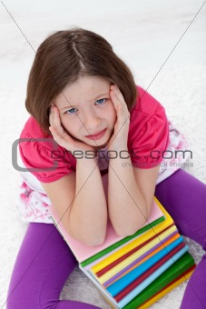Young girl with headache from too much learning