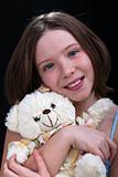 Young girl with her teddy bear