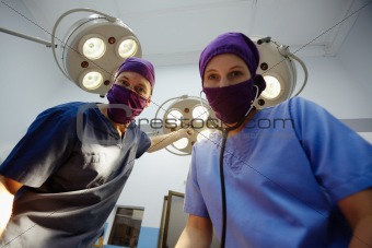 Operation room in clinic with medical staff during surgery