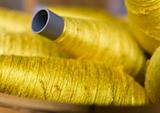 Sewing threads golden color