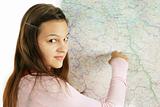 Teenage girl pointing at map