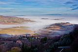 Tuscan landscape in the fog, Montepulciano (Italy). 
