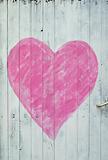 Wooden door with pink heart