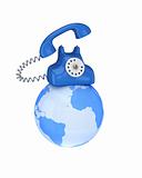 Blue retro telephone on a globe