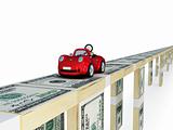 Red car driving on a bridge made of money .