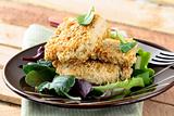 fried chicken in sesame seeds with salad