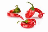 curved red chilli peppers isolated on white
