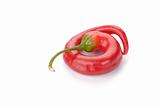 curved red chilli pepper isolated on white