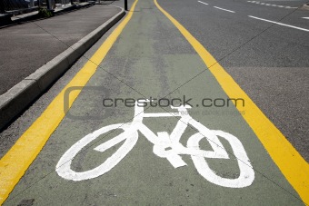 A cycle lane and white sign.