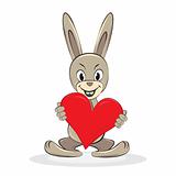Cartoon funny rabbit holds big red heart