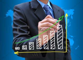 businessman hand drawing business graph