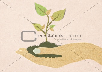 Green leaf with hand recycled paper craft 
