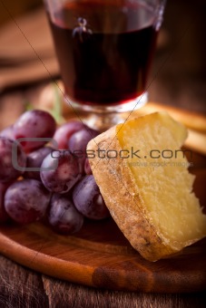 Piece of Pecorino and red Grapes