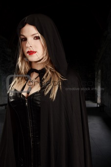 Female vampire in hooded cape