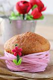 homemade cupcake are decorated with a pink ribbon
