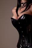 Busty woman in black corset 