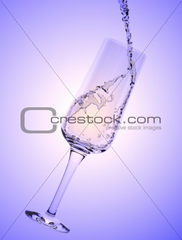 White Wine being poured in a wine glass