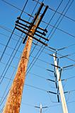 Wooden utility pole with power lines