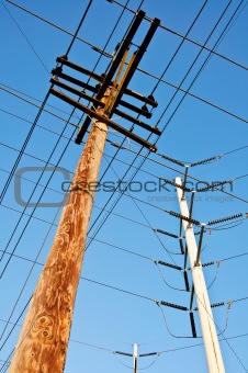 Wooden utility pole with power lines